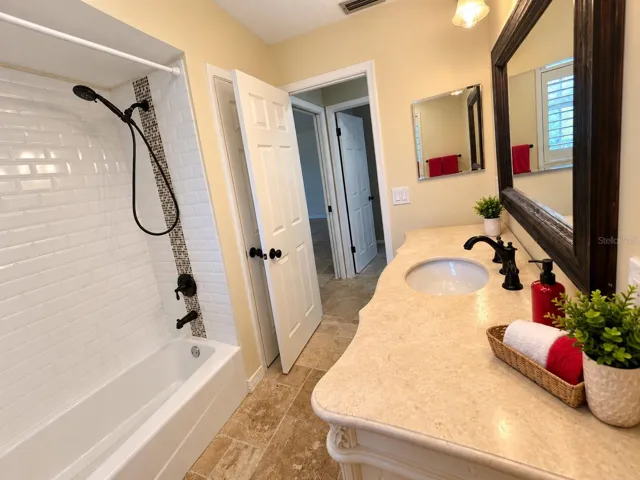 Neutral and detailed tiled shower gives the new home owner the ability to add their own finishing touches.