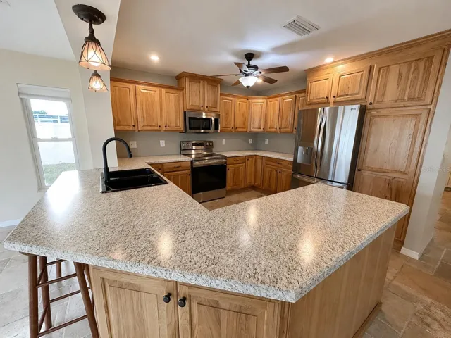 This beautiful kitchen offers solid Hickory wood cabinets, high end stainless steel appliances ,plenty counter space/ cabinet space.