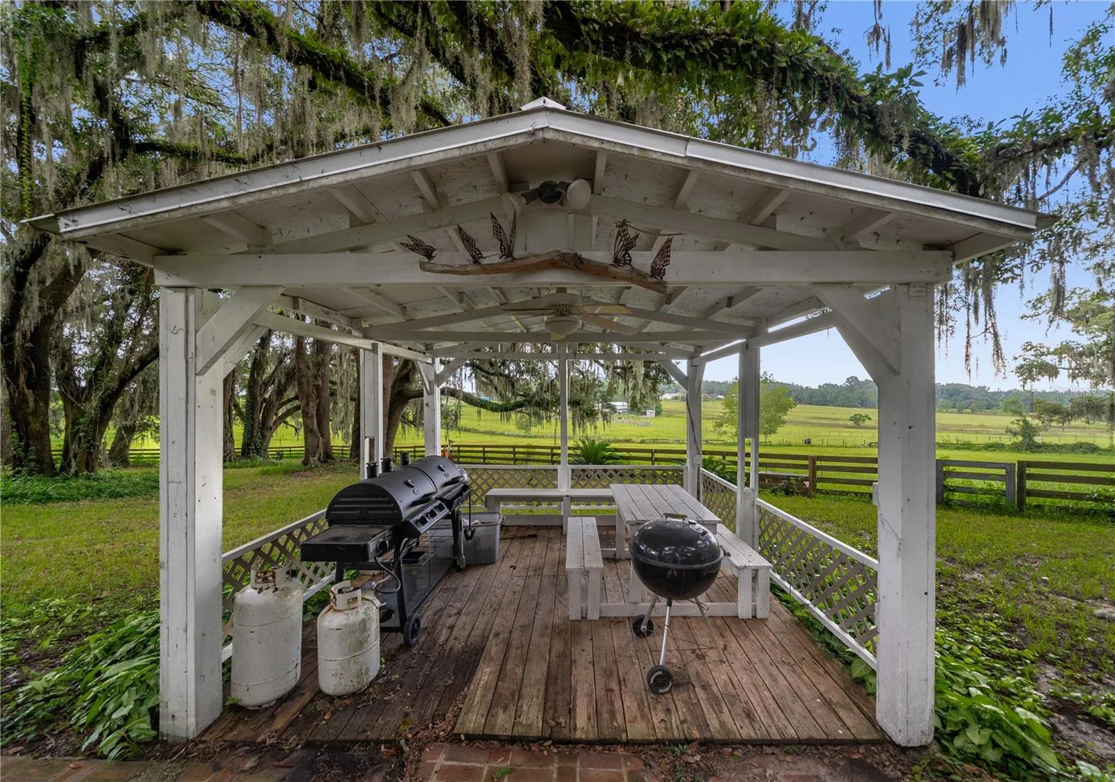 Covered outdoor gazebo with picnic seating and beautiful pasture views.