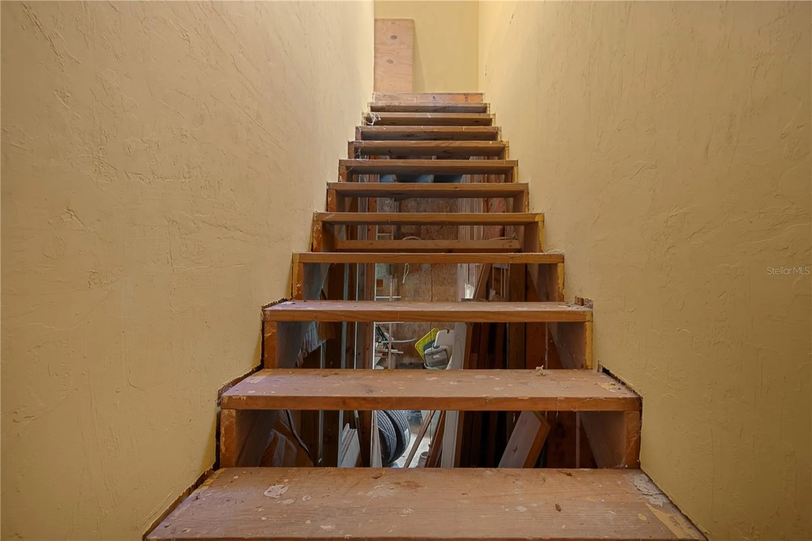 Stairs leading to the bonus room above the garage.