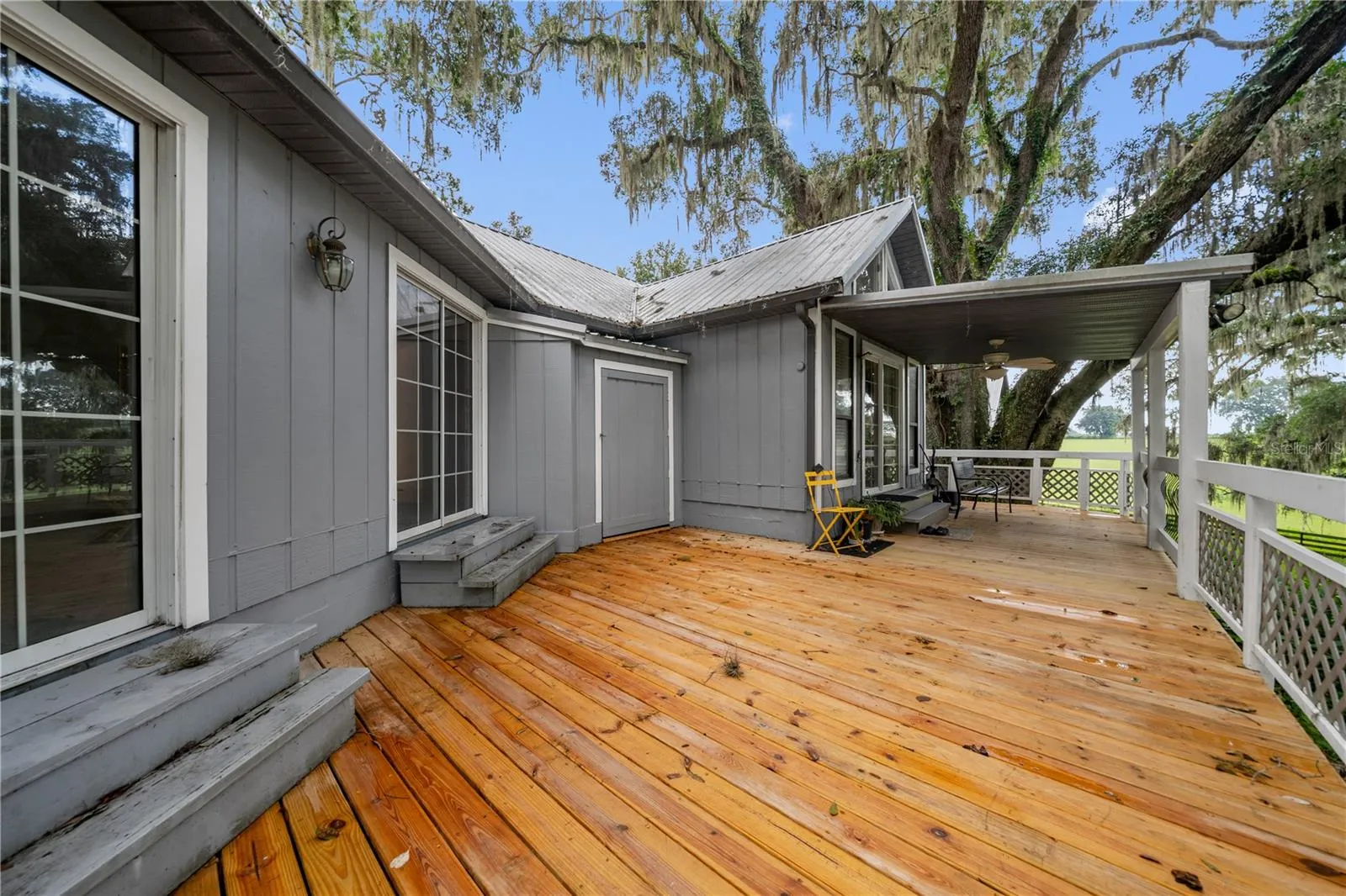 Back patio view. Living room sliding doors.