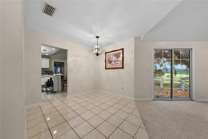 Entrance foyer with the kitchen and family room to the left and the living room to the right.
