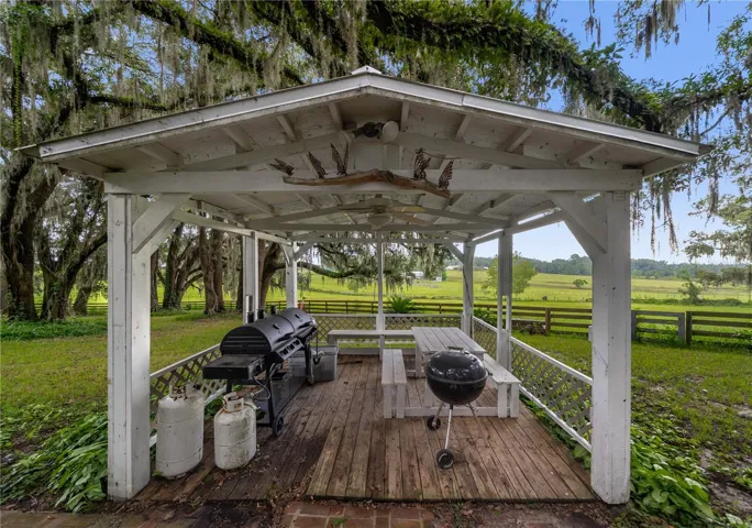 Covered outdoor gazebo with picnic seating and beautiful pasture views.