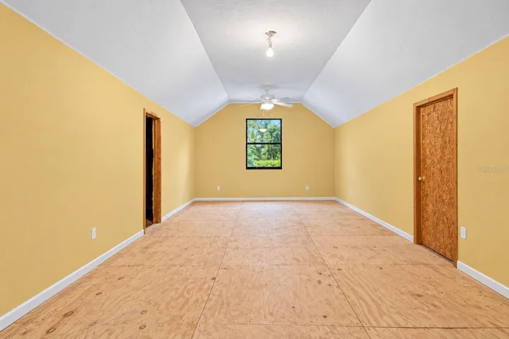 Bonus Room Above the Garage. This photo has been digitally cleaned up to remove personal items and clutter for a clearer view of the room and its layout.