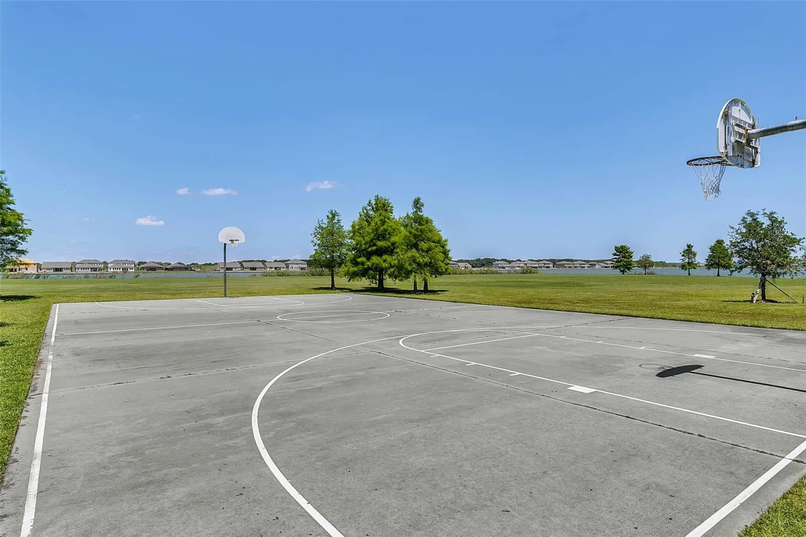 Community Basketball Courts overlooking the private Waterside Pointe lake.