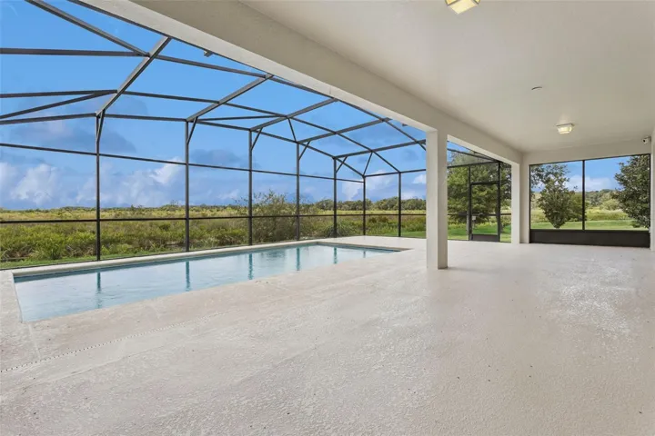 Large screen enclosed lanai with inground pool, overlooking the canal and conservation area