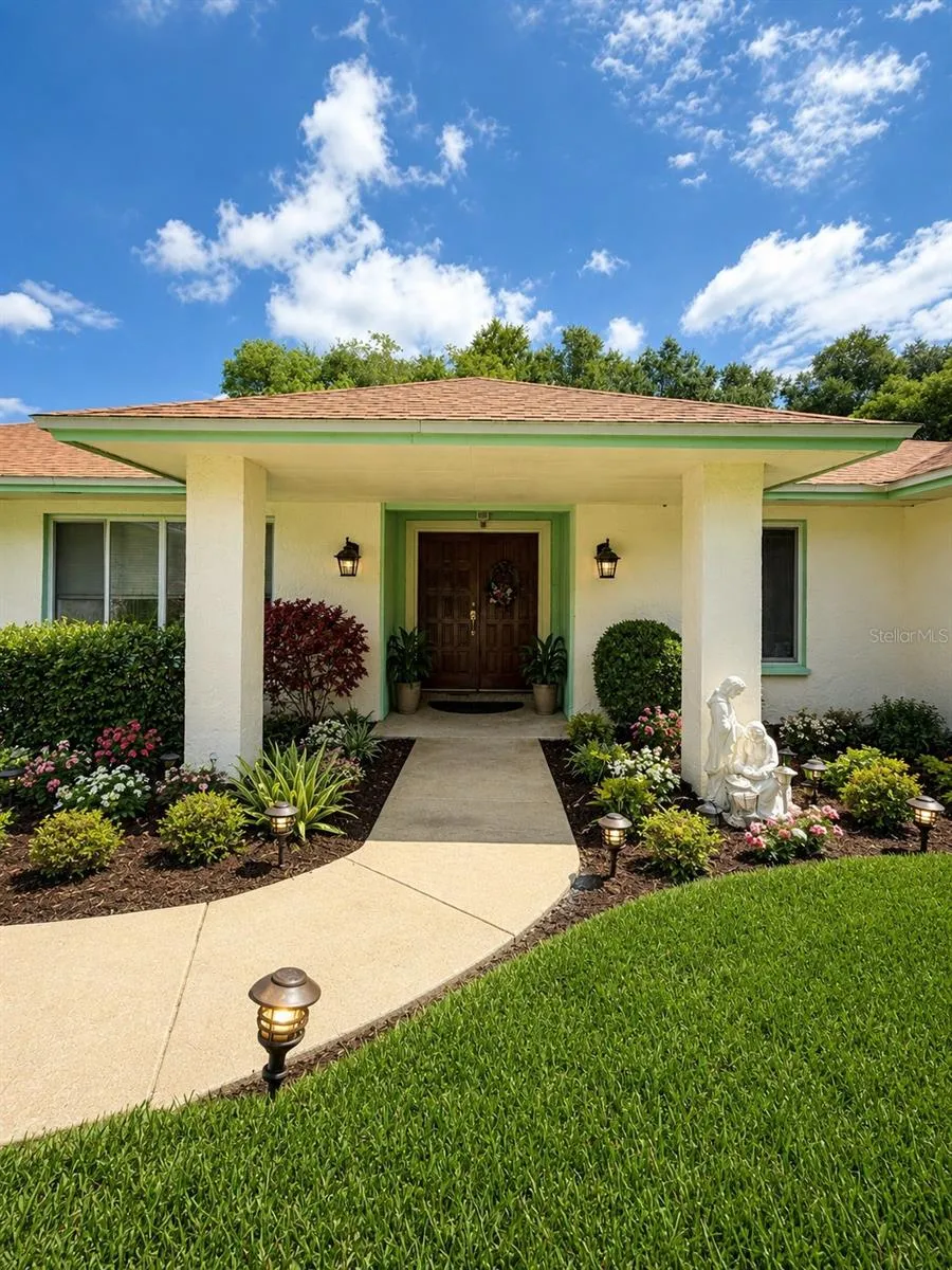 AI-enhanced edit of the front entrance to showcase the property’s potential and visualize an inviting, updated curb appeal.