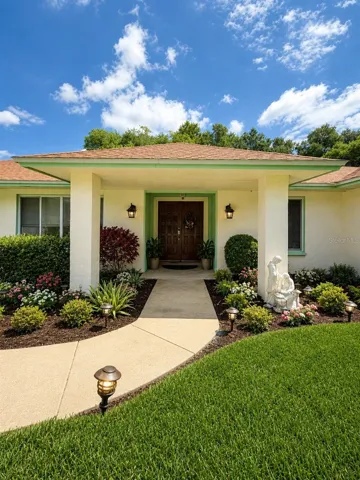 AI-enhanced edit of the front entrance to showcase the property’s potential and visualize an inviting, updated curb appeal.