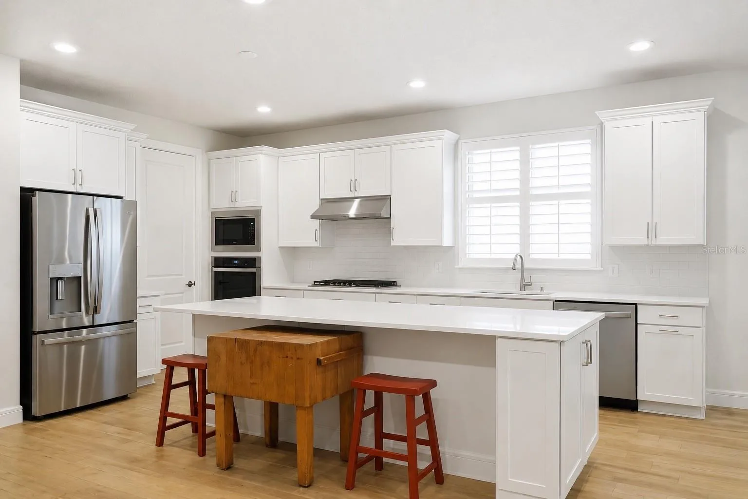 Kitchen Fridge with wall over and microwave
