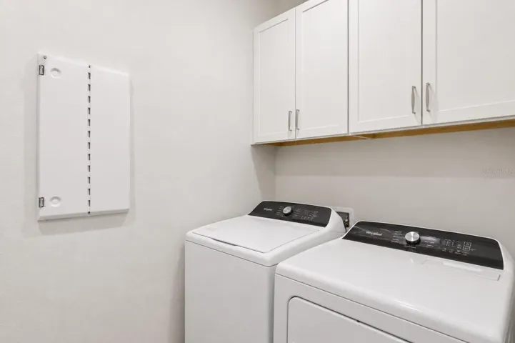 Laundry room with cabinets