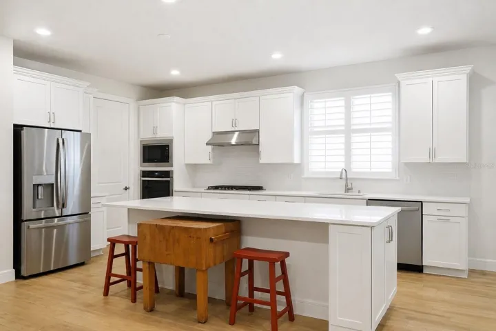 Kitchen Fridge with wall over and microwave