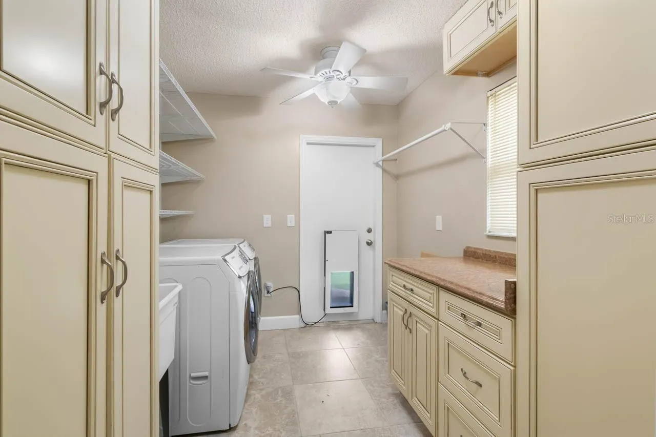 Laundry room with doggy door to the yard