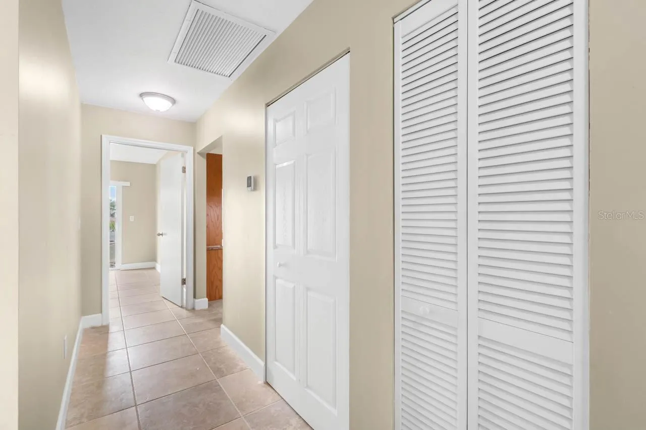 Hallway has extra linen closet