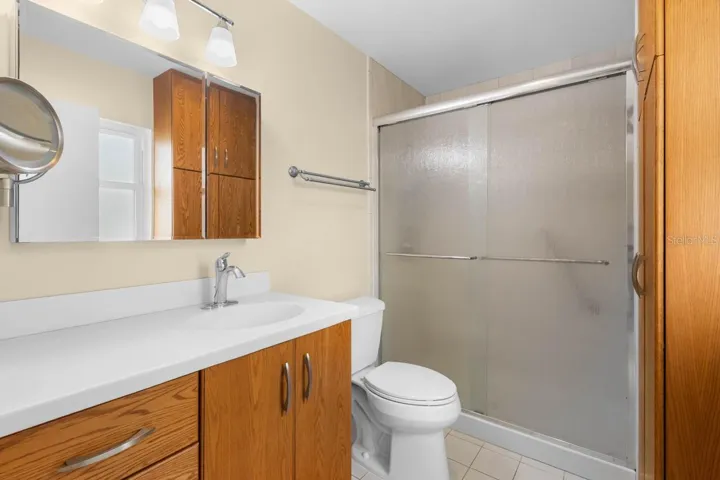 Large linen cabinet to right
