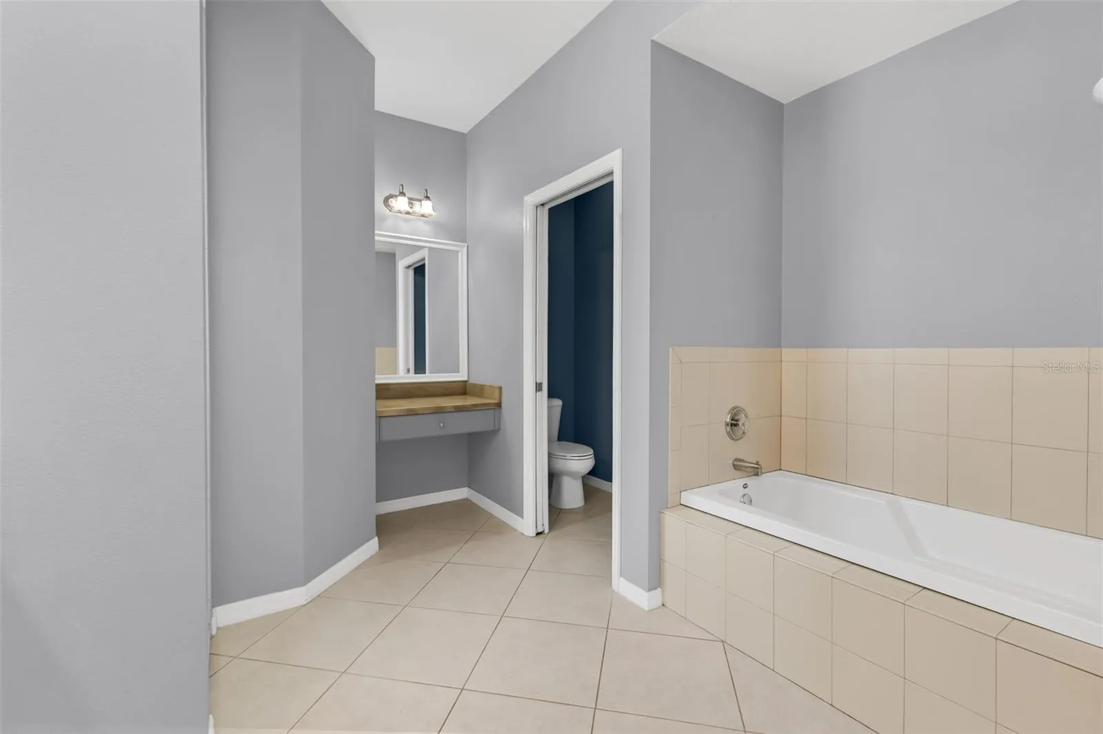Garden tub and makeup vaniety.