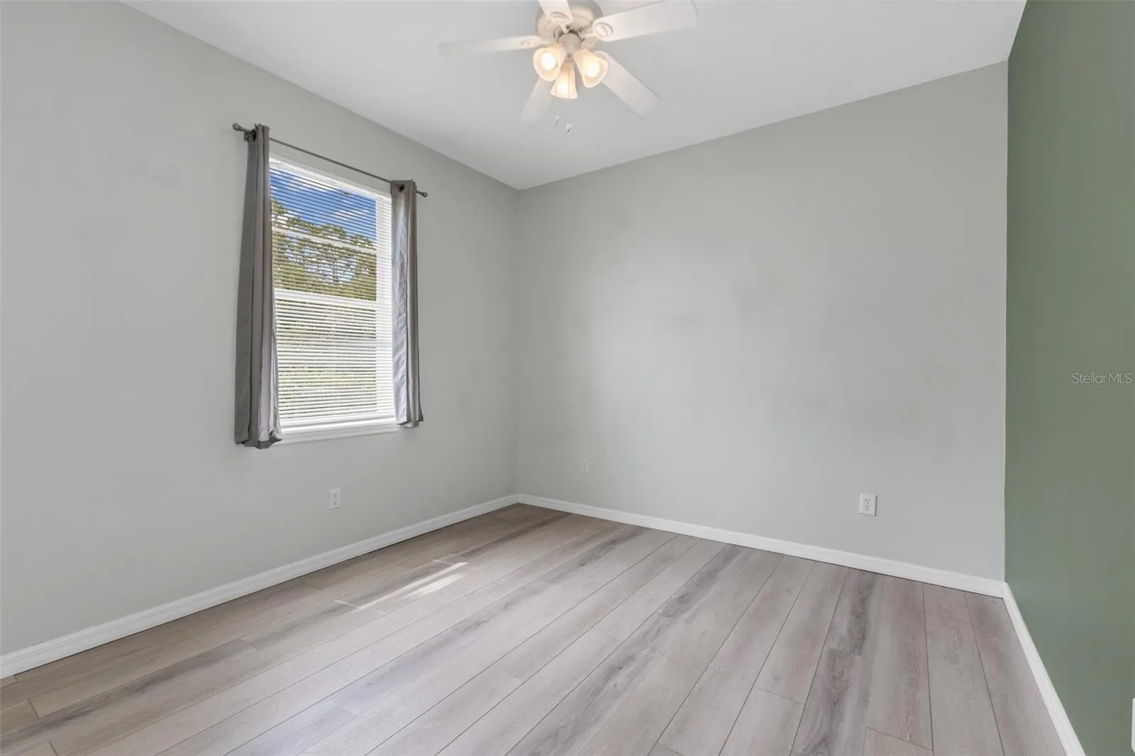 Guest bedroom 3 with luxury vinyl flooring.