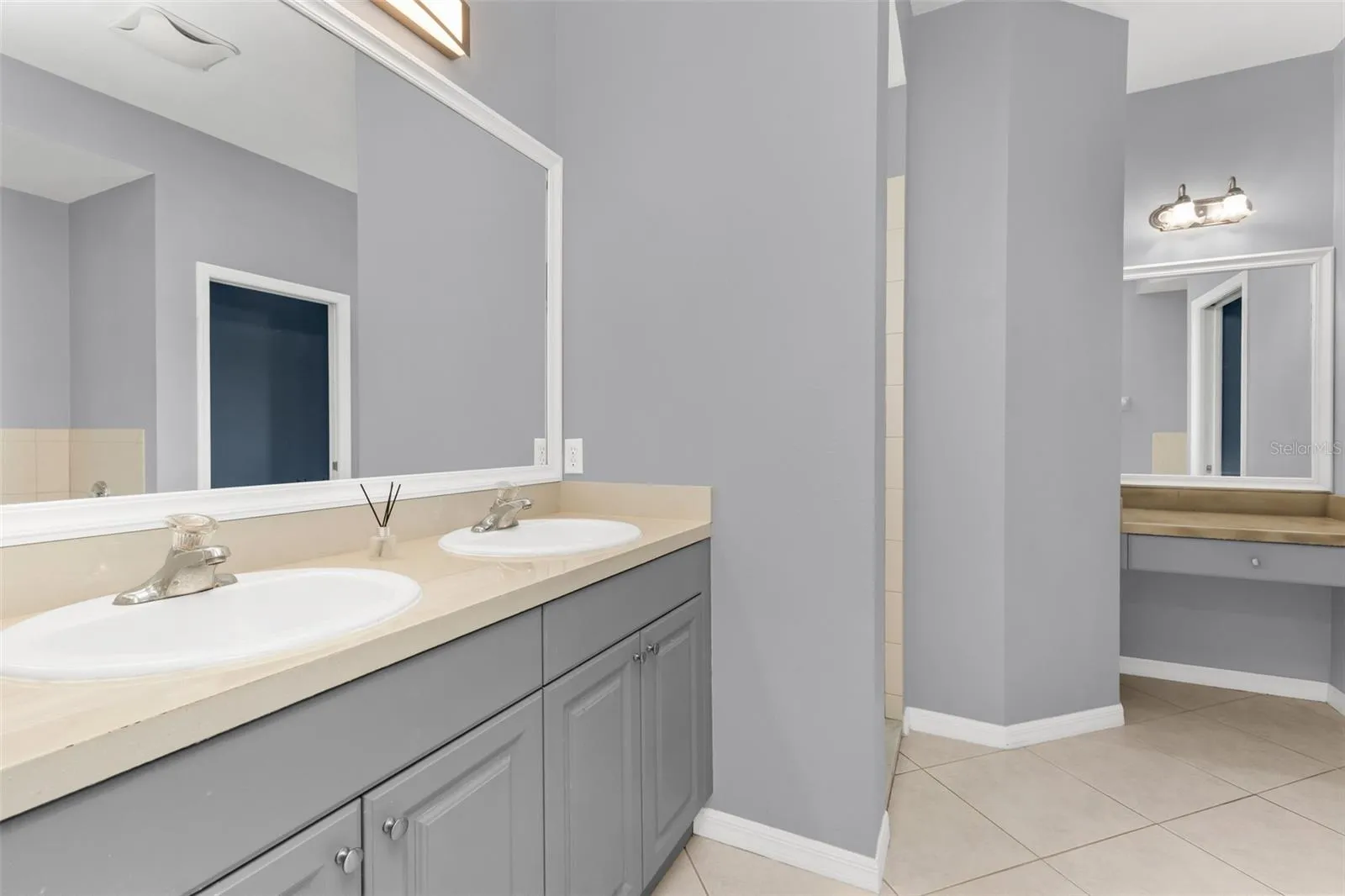 Primary bathroom features dual sinks, walk-in-shower, and garden tub.