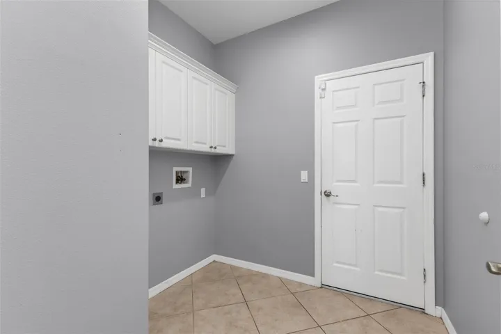 Laundry room with extra cabinets.