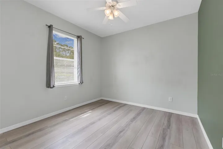 Guest bedroom 3 with luxury vinyl flooring.