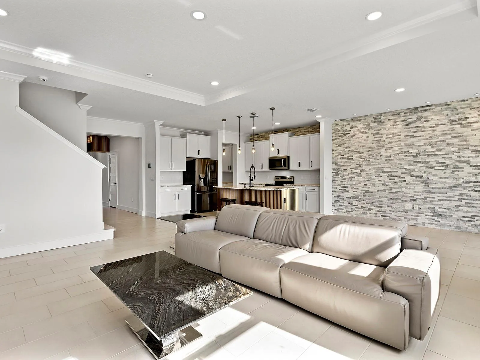 great room flows from the kitchen and dining room