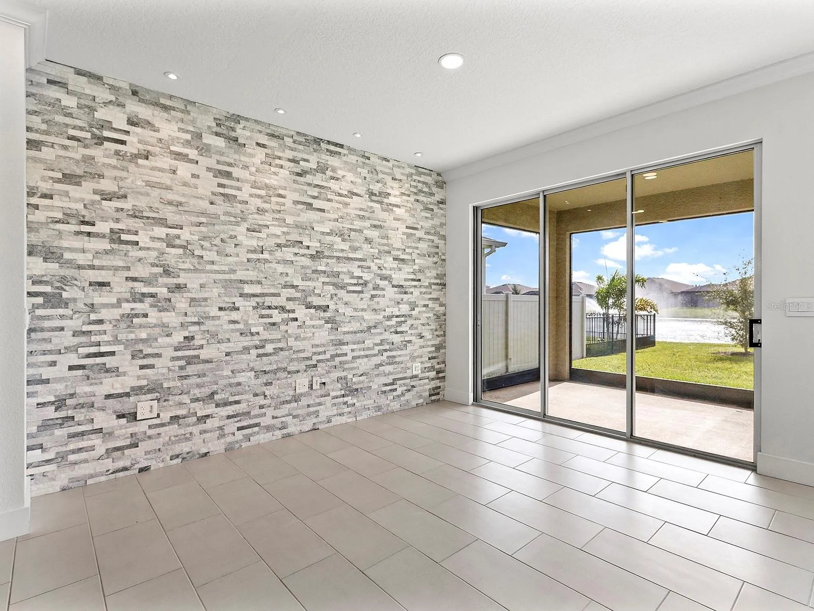 Formal dining room with accent wall stone