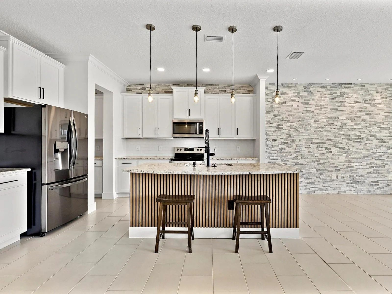 Kitchen opens to formal dining room