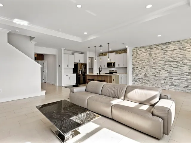 great room flows from the kitchen and dining room