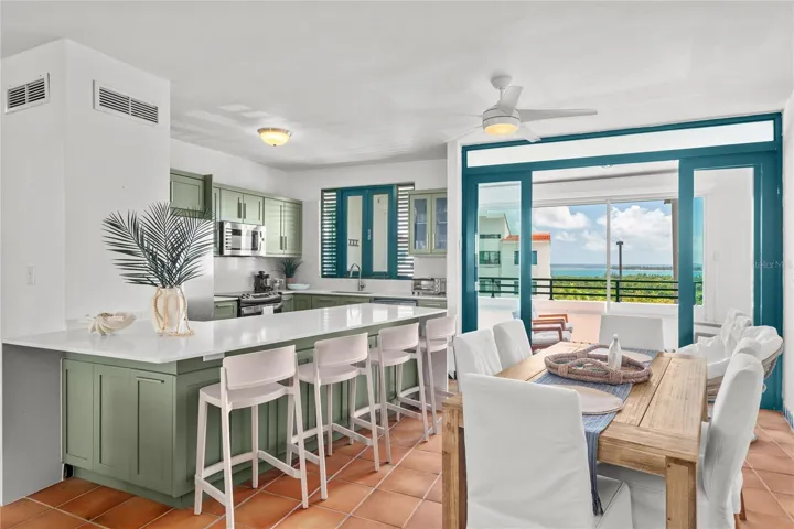 Dining room and kitchen, water views from inside
