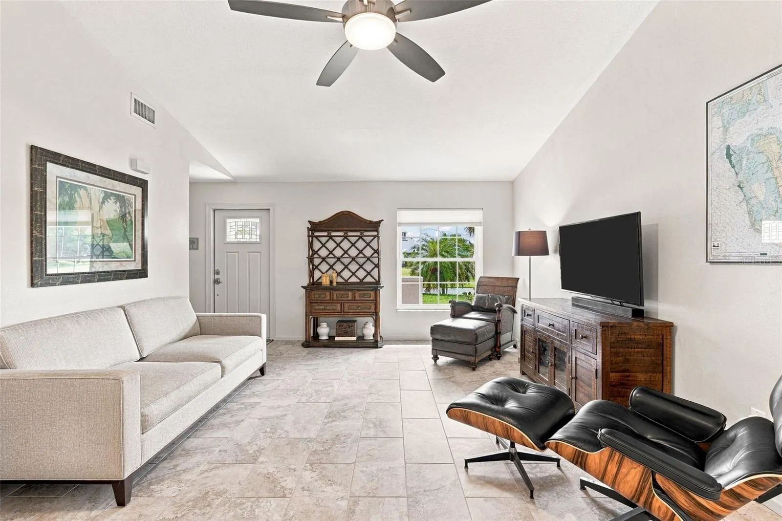Foyer and Living Room Boast Exceptional Staggered Brick-like Tile Flooring