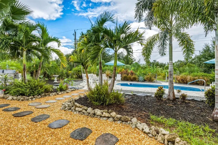 Tropical Oasis Found with Mature Florida Palms & Walkways