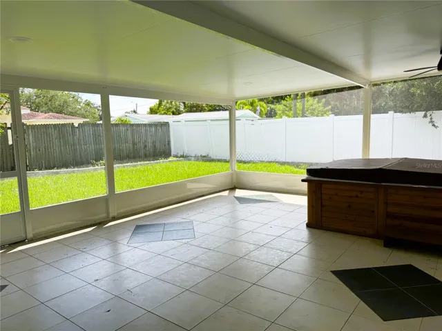 Enclosed Rear Patio with Brand New Screens and Hot Tub