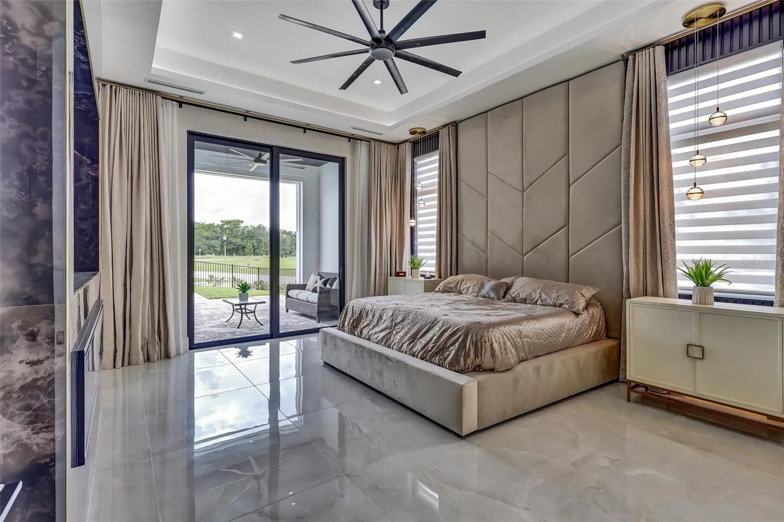 First-floor primary suite with custom built bed with direct access to its private outdoor retreat