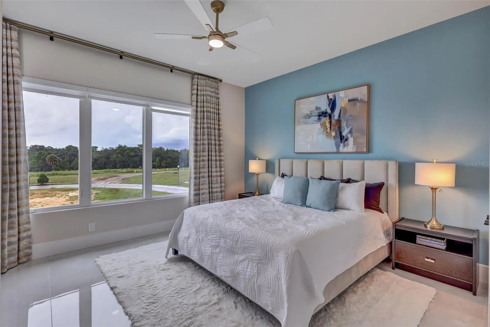 Spacious guest suite with peaceful views across the property and pool
