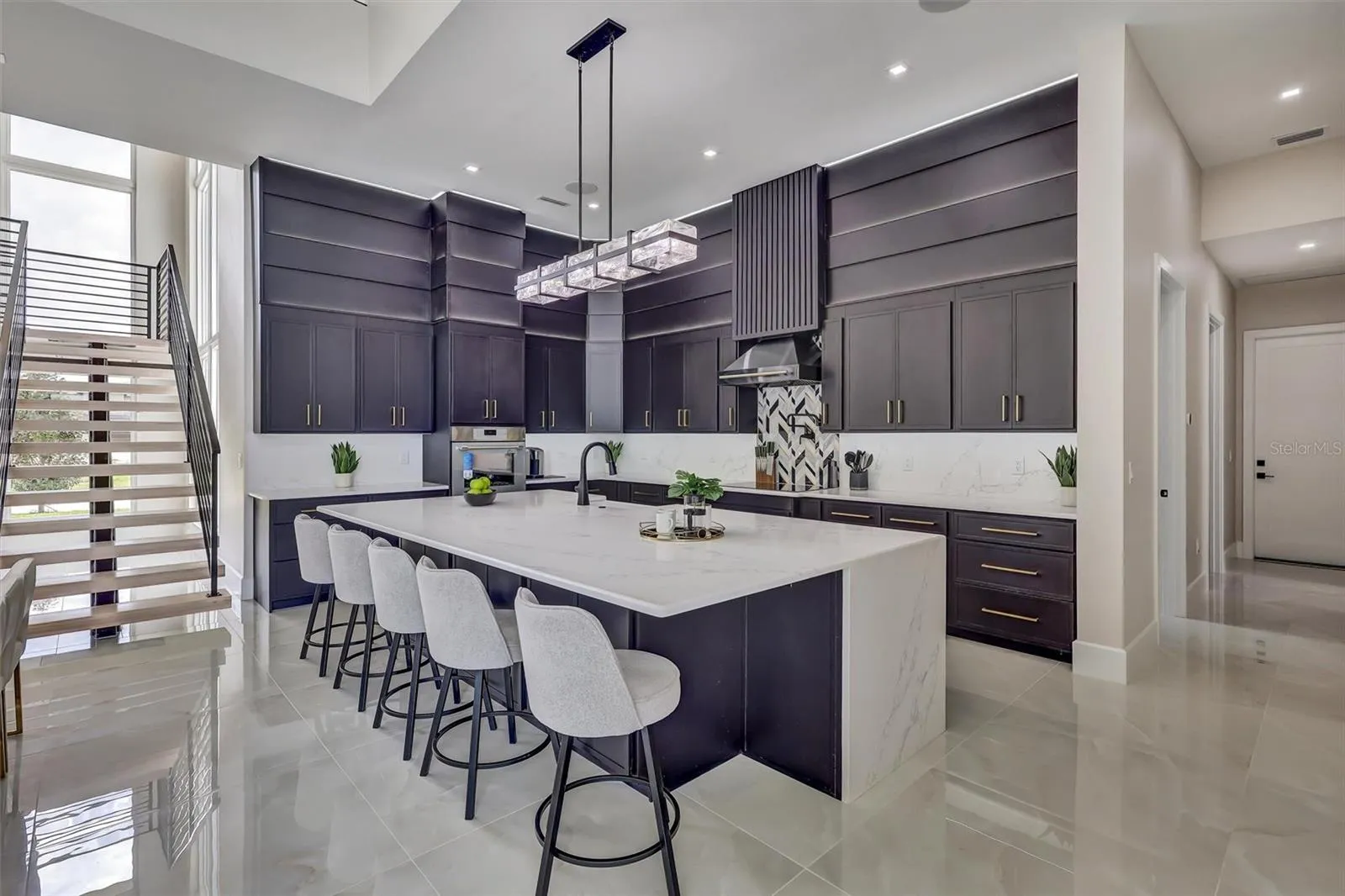 Designer kitchen with substantial quartz island and generous seating
