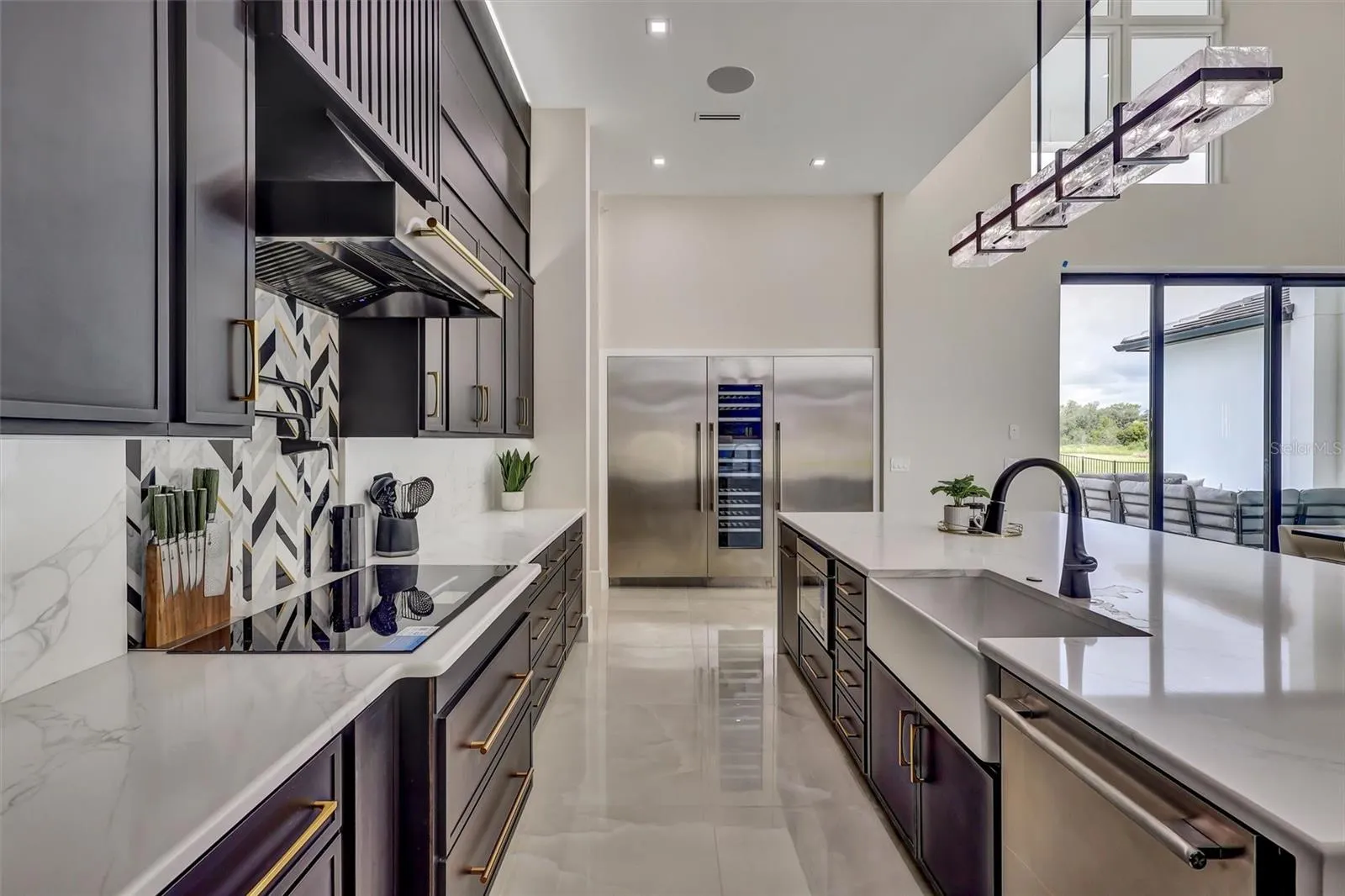 Beautifully appointed kitchen with abundant preparation and storage space. Thermador Appliances including a temperature controlled wine colum