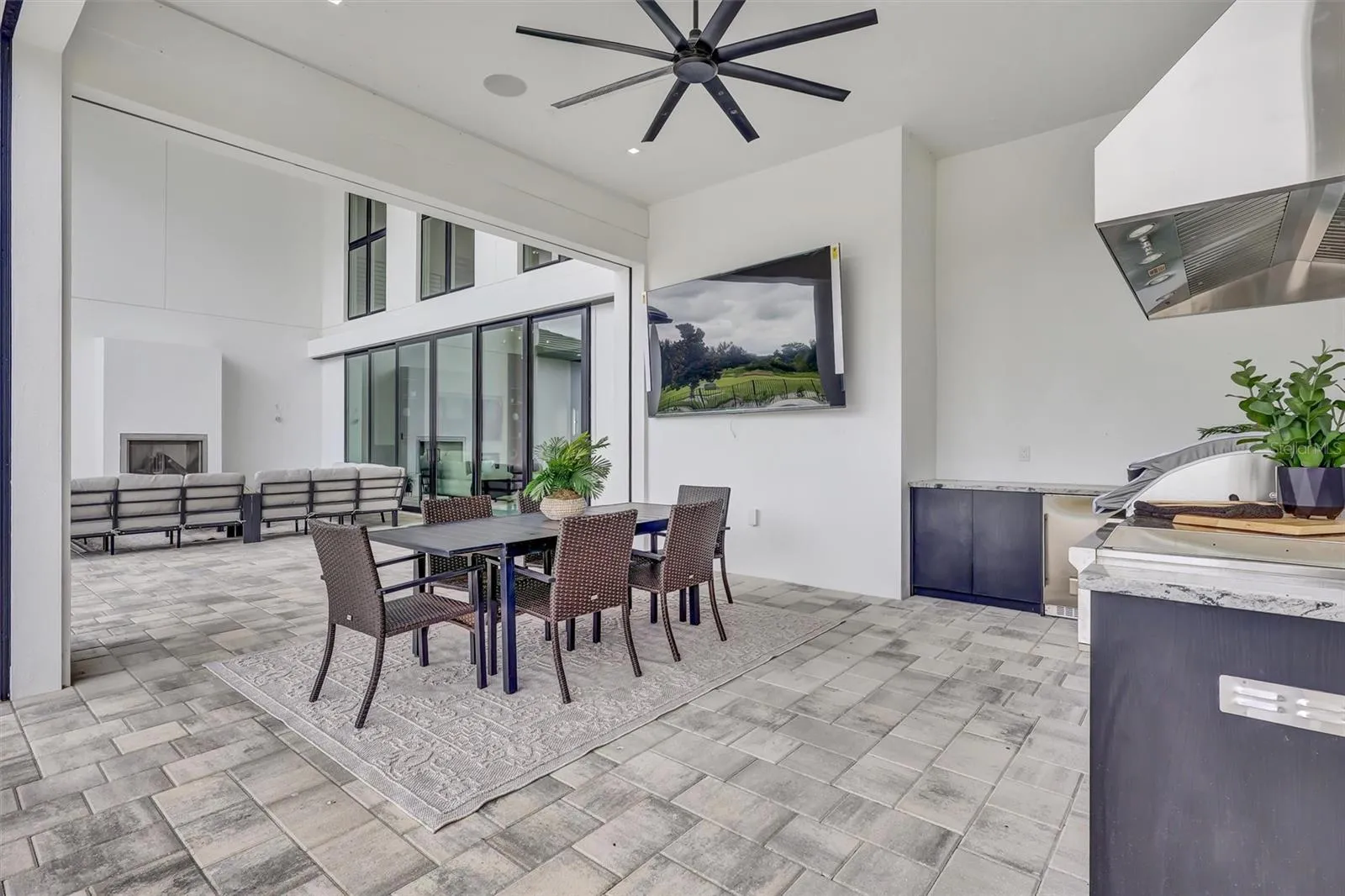 Full summer kitchen and covered dining area for effortless outdoor entertaining