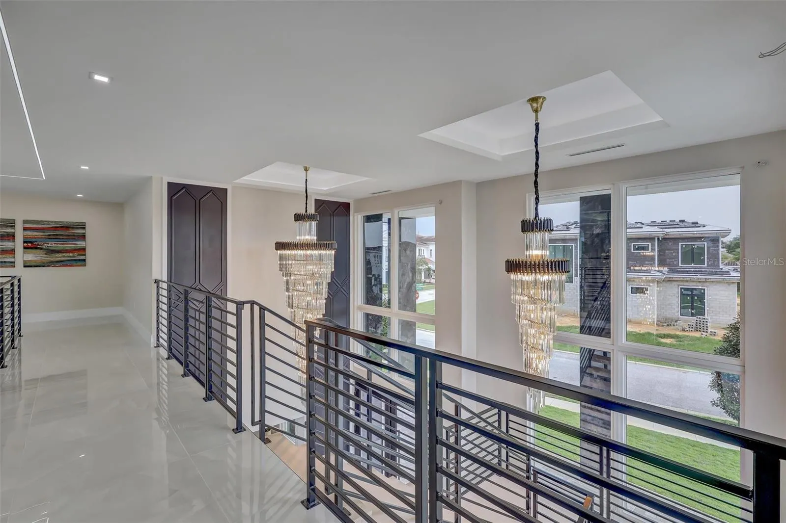 Upper gallery overlooks the dramatic two-story Great Room