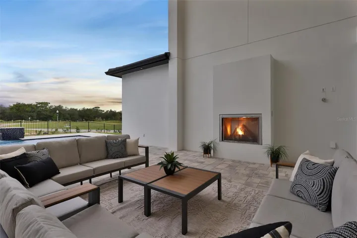 Intimate fireside seating overlooking the pool and grounds