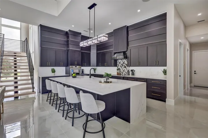 Designer kitchen with substantial quartz island and generous seating
