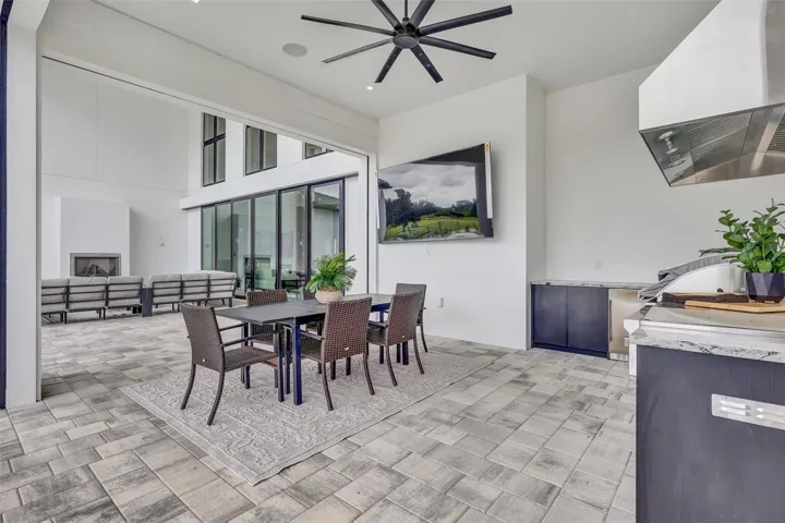 Full summer kitchen and covered dining area for effortless outdoor entertaining