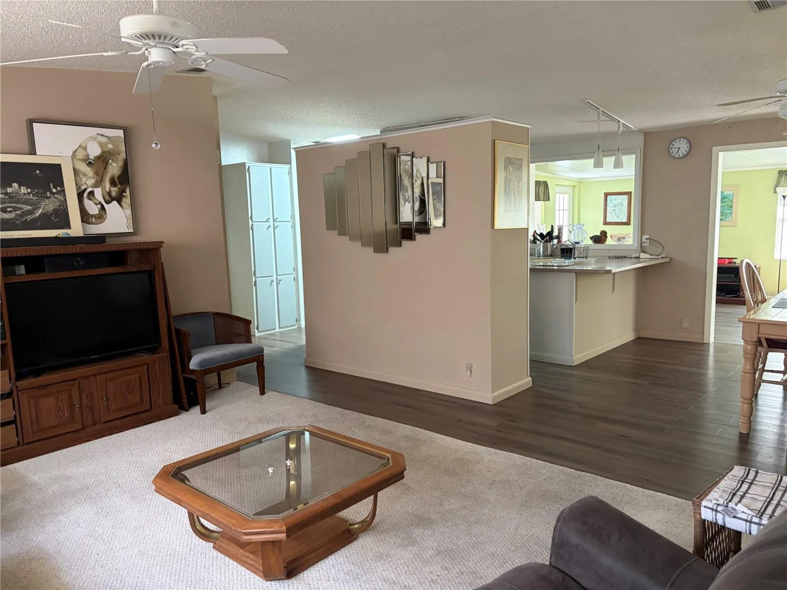 Living room facing kitchen, dining and bonus room