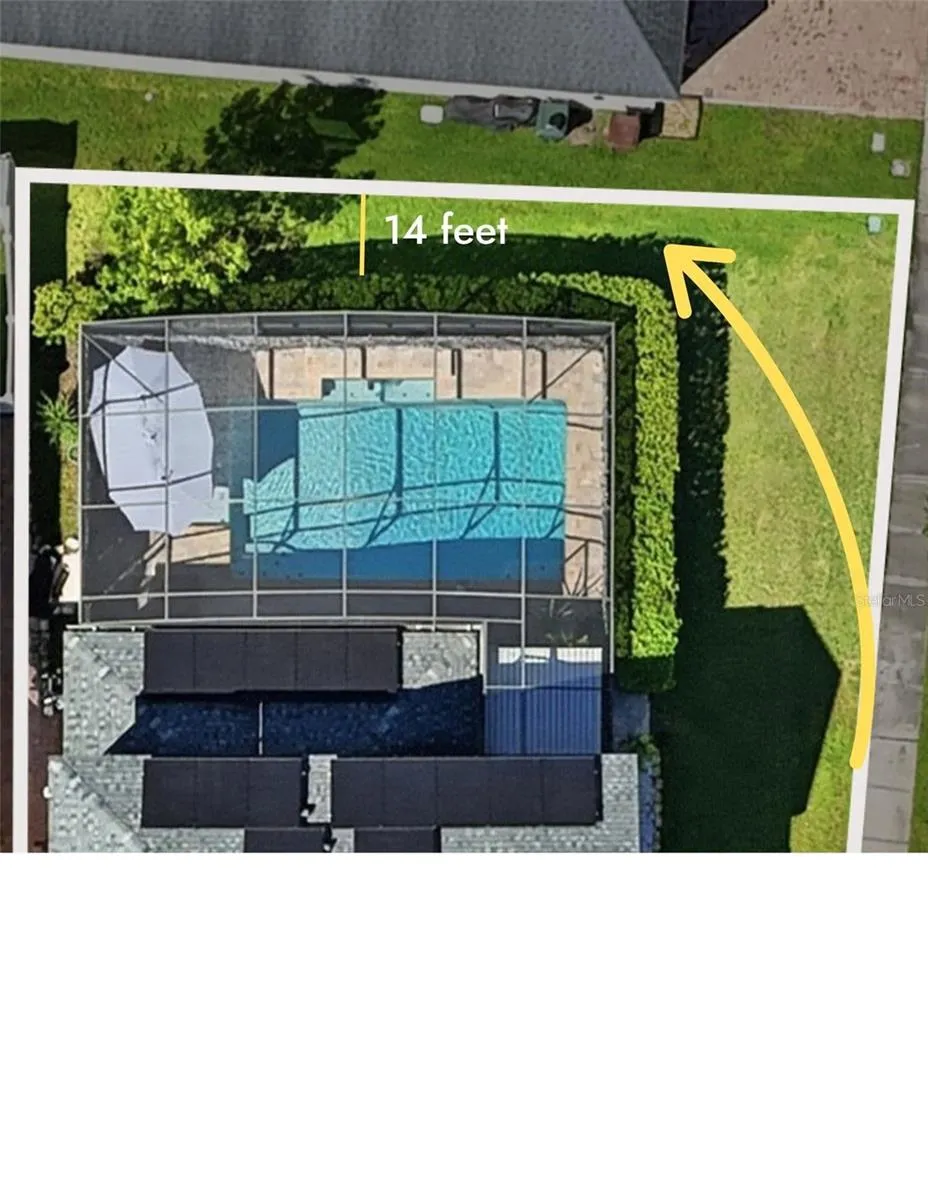 Photo is Virtually enhanced.                 The hedges can be removed to allow for fencing around the entire property, with plenty of additional yard space behind them to create your own private oasis.