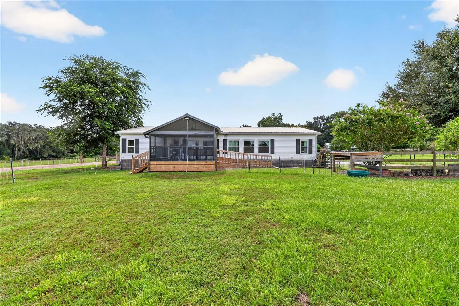 Lush paddocks in front of the stunning screened porch
