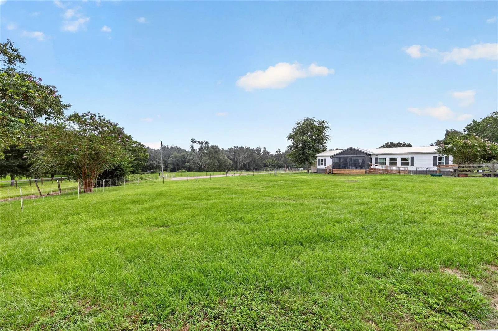 Home with lush pastures in front
