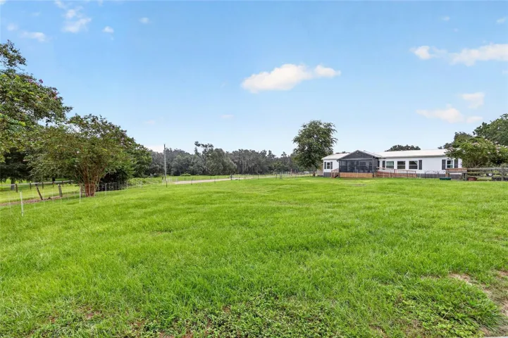 Home with lush pastures in front