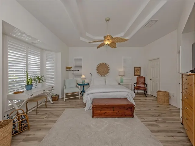 primary bedroom with coffered ceiling