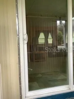 Sliding door into living room from front porch.