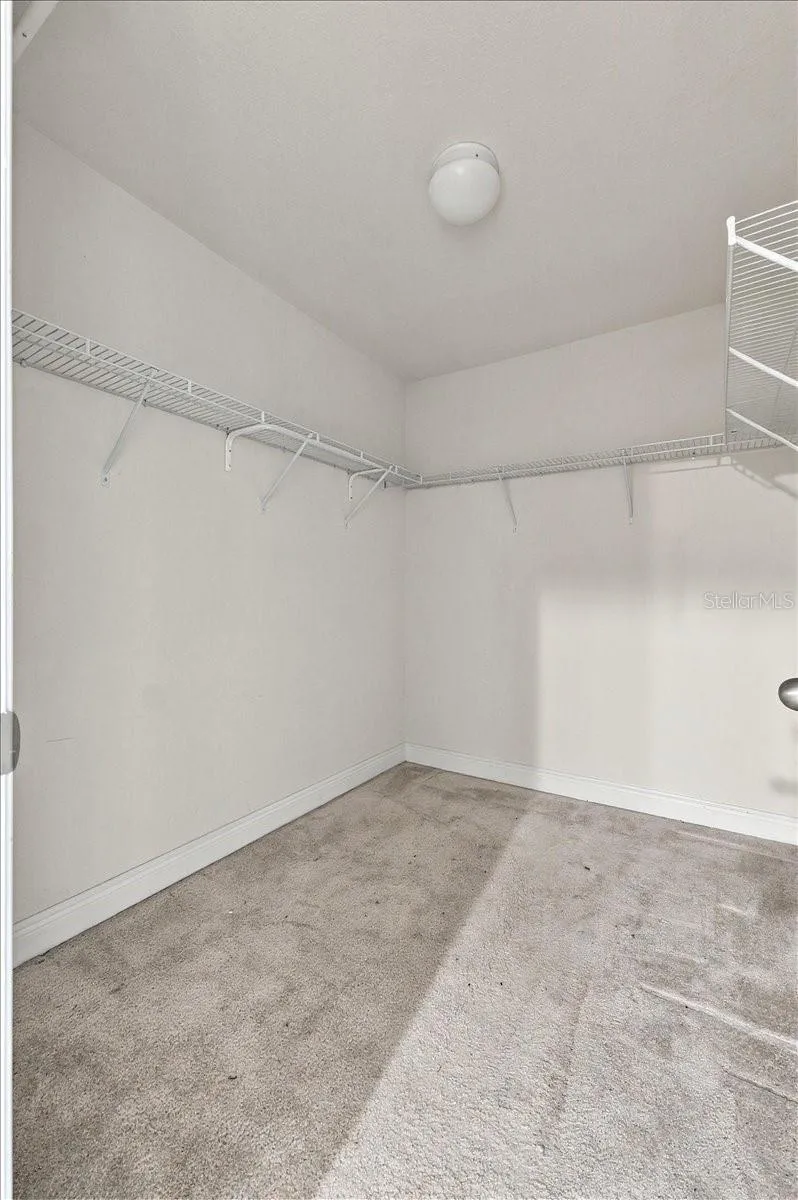 Spacious walk-in closet with built-in shelving