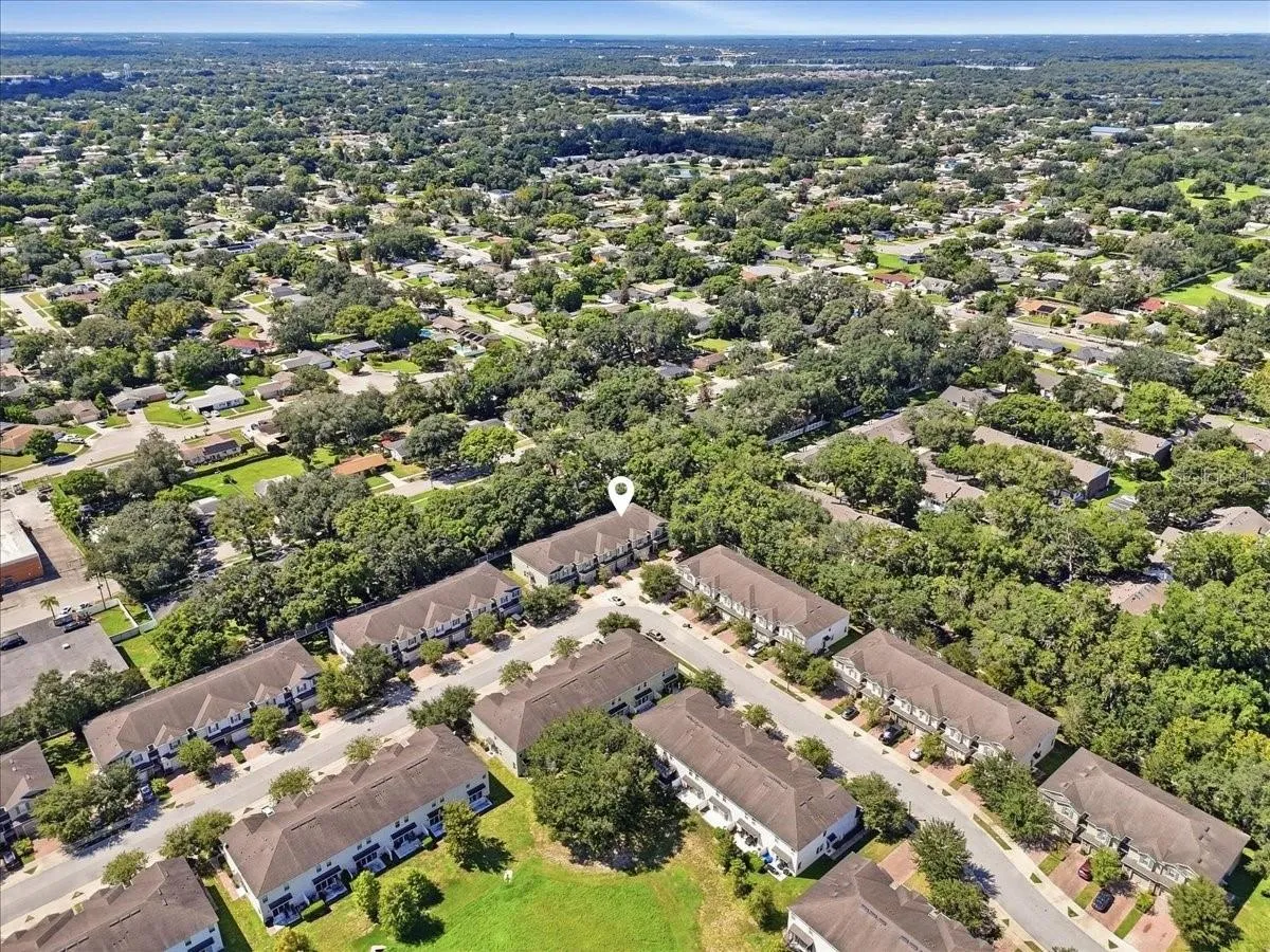 Aerial view showcasing the tree-lined community and prime lot location