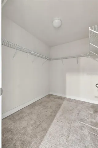 Spacious walk-in closet with built-in shelving